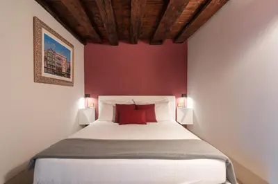 Letto o letti in una camera di San Pietro Cozy Studio R&R