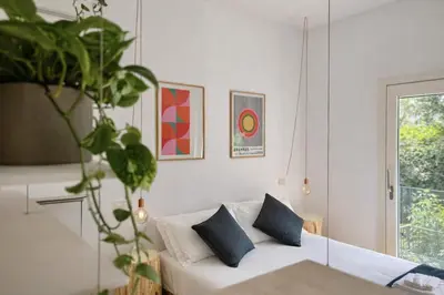 Letto o letti in una camera di STUDIO 14 - apt design con terrazza sul fiume - 2 biciclette incluse - vicino al centro