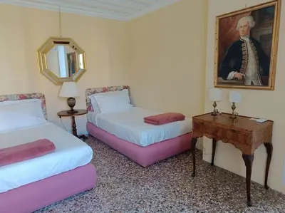 Letto o letti in una camera di Palazzo Querini Accademia