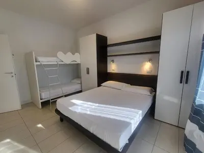 Letto o letti in una camera di Residence Equilio Family Apartments
