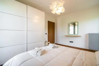 Letto o letti in una camera di enJoy Home - Appartamento ampio, luminoso e immerso nel verde