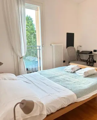 Letto o letti in una camera di enJoy Home - Appartamento ampio, luminoso e immerso nel verde
