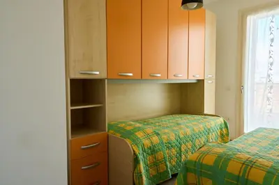Letto o letti in una camera di Appartamento Nico per Famiglie-Lido di Jesolo-Piazza Trieste
