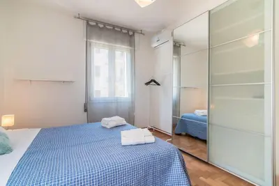 Letto o letti in una camera di enJoy Home - Bilocale sulle Riviere a due passi dalla Specola