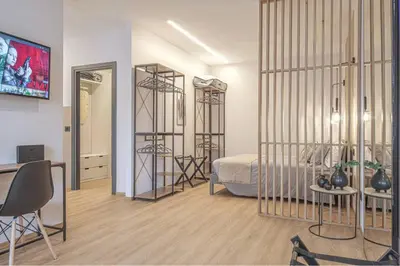 Letto o letti in una camera di A 3 minuti dal centro storico In Style Apartment con parcheggio gratuito