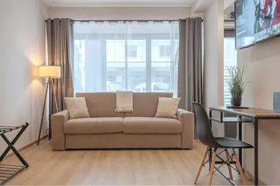 Area soggiorno di A 3 minuti dal centro storico In Style Apartment con parcheggio gratuito