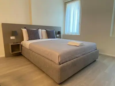 Letto o letti in una camera di Residenza SubitoSanto - Appartamento 1A Ruzzante