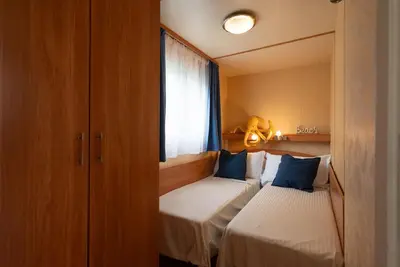 Letto o letti in una camera di Campeggio Paradiso