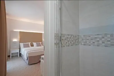 Letto o letti in una camera di Hotel Strand a frontemare