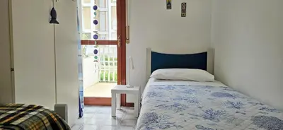 Letto o letti in una camera di Tellina FronteMare