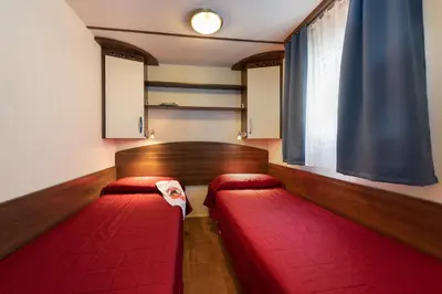Letto o letti in una camera di Camping Village Garden Paradiso