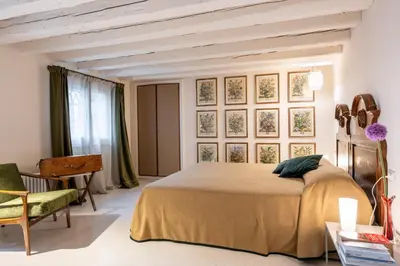 Letto o letti in una camera di Palazzo Borgoloco