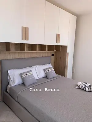Letto o letti in una camera di Casa Bruna - appartamento Renato