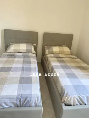 Letto o letti in una camera di Casa Bruna - appartamento Renato