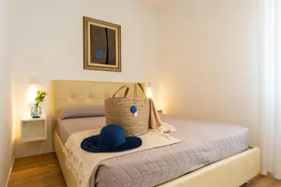Letto o letti in una camera di Trilocale Piazza DRAGO - Adria Holiday Jesolo - FAMILY APARTMENT