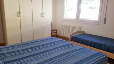 Letto o letti in una camera di Condominio Olimpo family apartment