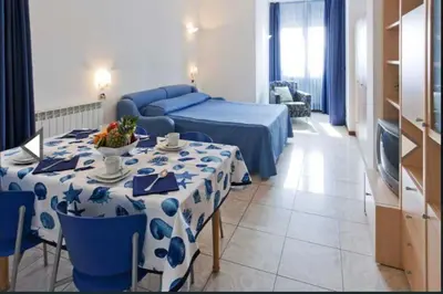 Letto o letti in una camera di Piazza principale angolo con il Lungomare