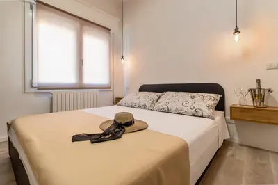 Letto o letti in una camera di GIGI HOUSE [appartamento PIAZZA MAZZINI] 300m dal mare