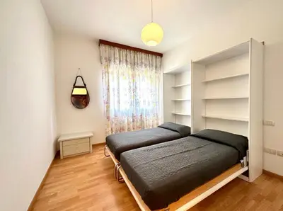 Letto o letti in una camera di Ada 2 - Carraro Immobiliare - Family Apartments