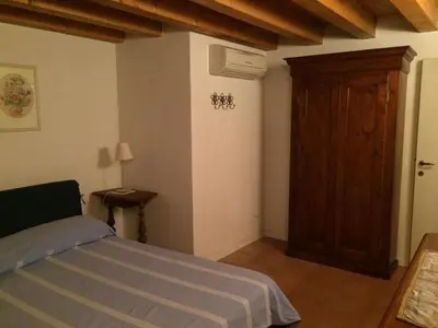 Letto o letti in una camera di Villa Pastori