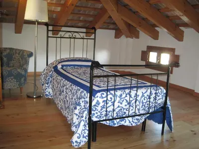 Letto o letti in una camera di Villa Pastori
