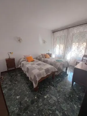 Letto o letti in una camera di Alla torre dell'orologio