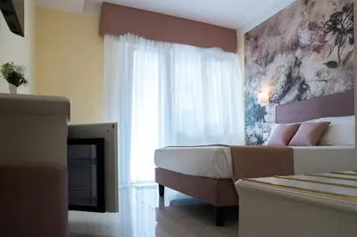 Letto o letti in una camera di Guest House Train Station Venice - Atika & Atif