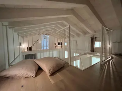 Letto o letti in una camera di La Casetta in calle AparstSuite