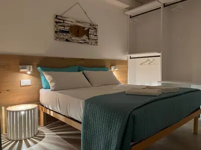Letto o letti in una camera di La Casetta in calle AparstSuite