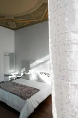 Letto o letti in una camera di Scrovegni Room & Breakfast
