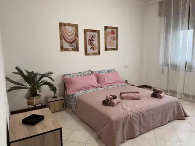 Letto o letti in una camera di Ornella's apartment - Relax near Venice