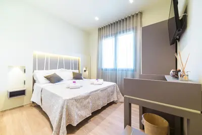 Letto o letti in una camera di Hotel Calaluna