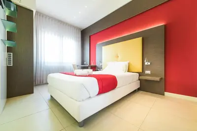 Letto o letti in una camera di Hotel Calaluna