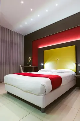 Letto o letti in una camera di Hotel Calaluna