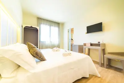 Letto o letti in una camera di Hotel Calaluna