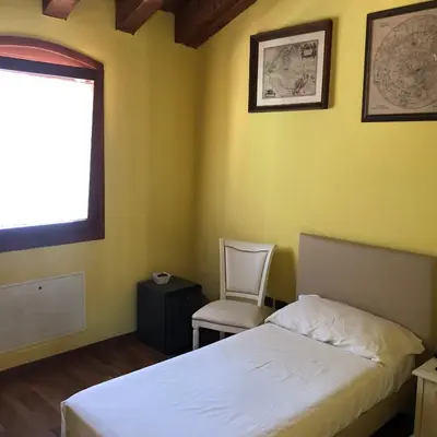 Letto o letti in una camera di Villa Iris