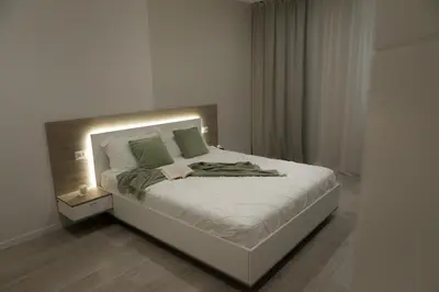 Letto o letti in una camera di RomanApartments