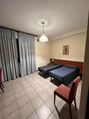 Letto o letti in una camera di Hotel Colonna