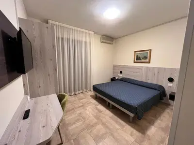 Letto o letti in una camera di Hotel Colonna