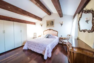Letto o letti in una camera di Attic behind St. Mark's Square