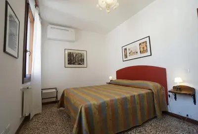 Letto o letti in una camera di Campo San Lorenzo