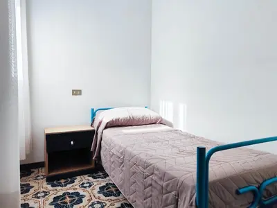 Letto o letti in una camera di Ariston Fronte Mare