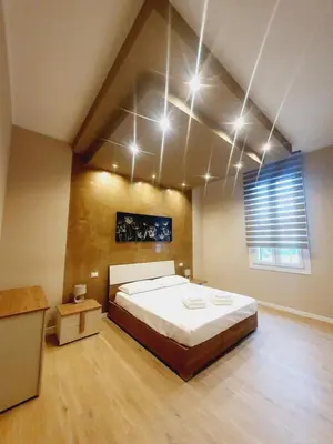 Letto o letti in una camera di Casa Tiffany
