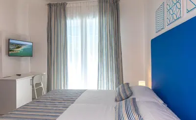 Letto o letti in una camera di Hotel Paolina