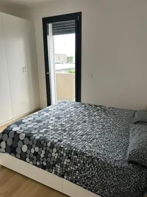 Letto o letti in una camera di Villetta bifamiliare Jesolo
