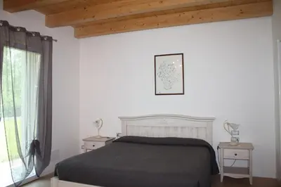 Letto o letti in una camera di Elis' Rooms