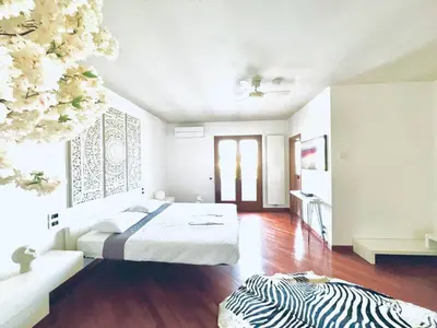 Letto o letti in una camera di Wow House - Ampia Villa con Piscina e sala giochi