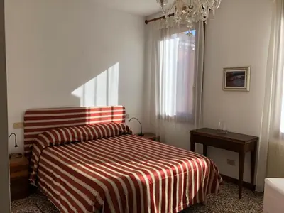 Letto o letti in una camera di San Lorenzo Garden