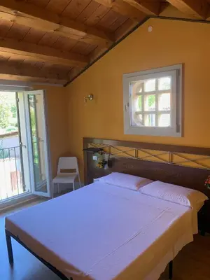 Letto o letti in una camera di Le Casette di Olga -Space for Nature and Sport Lovers-