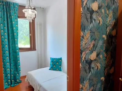 Letto o letti in una camera di Maison Papà, una casa per sentirsi a casa.